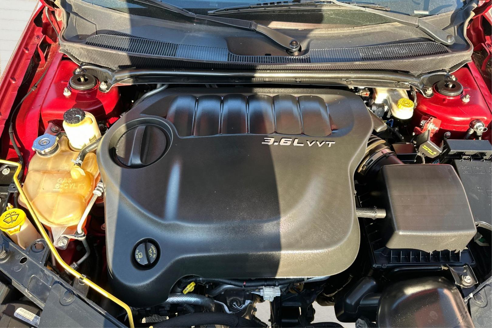 2012 Red Chrysler 200 Touring (1C3CCBBG7CN) with an 3.6L V6 DOHC 24V FFV engine, 6-Speed Automatic transmission, located at 7755 State Street, Midvale, UT, 84047, (801) 753-9063, 40.610329, -111.892159 - Photo#8