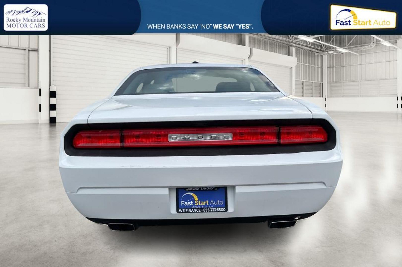 2012 White Dodge Challenger SXT (2C3CDYAG7CH) with an 3.6L V6 DOHC 24V engine, 4-Speed Automatic transmission, located at 7755 State Street, Midvale, UT, 84047, (801) 753-9063, 40.610329, -111.892159 - Photo#4