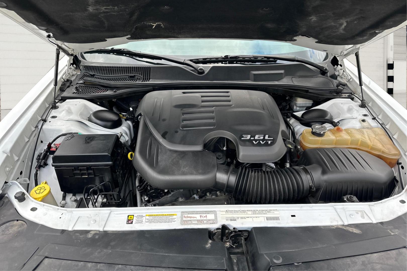 2012 White Dodge Challenger SXT (2C3CDYAG7CH) with an 3.6L V6 DOHC 24V engine, 4-Speed Automatic transmission, located at 7755 State Street, Midvale, UT, 84047, (801) 753-9063, 40.610329, -111.892159 - Photo#10