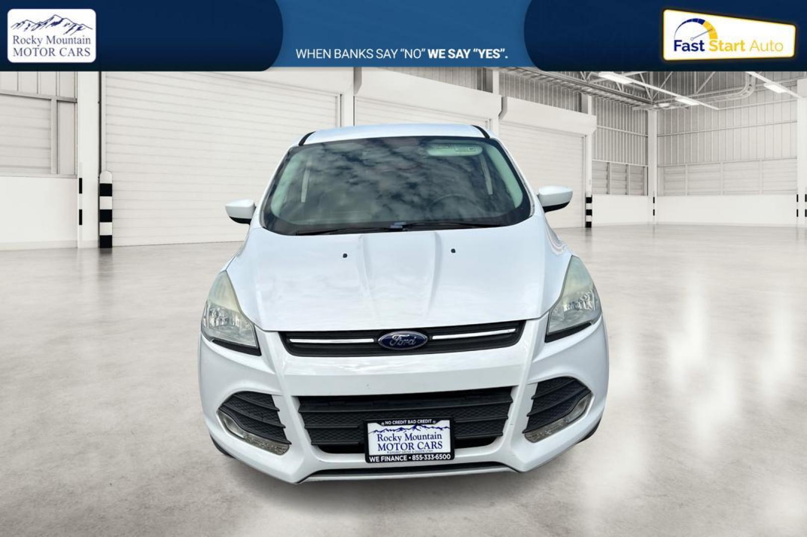 2013 White Ford Escape SE FWD (1FMCU0GX0DU) with an 1.6L L4 DOHC 16V engine, 6-Speed Automatic transmission, located at 7755 State Street, Midvale, UT, 84047, (801) 753-9063, 40.610329, -111.892159 - Photo#9