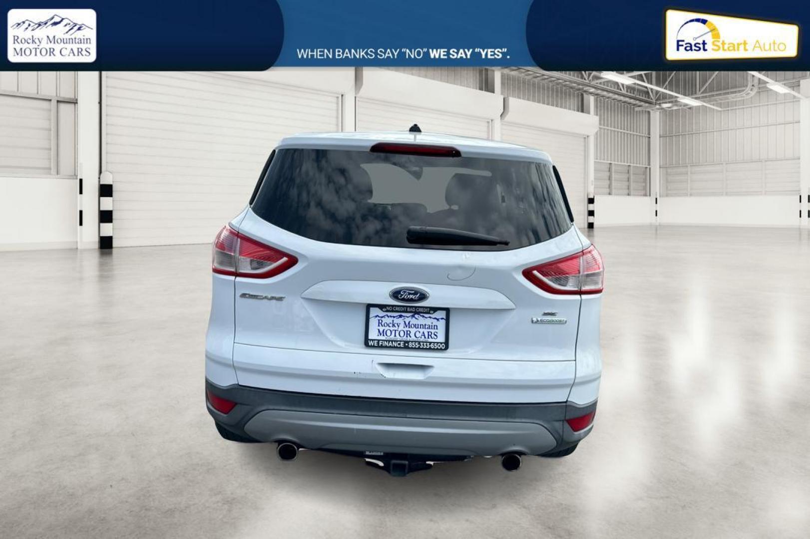 2013 White Ford Escape SE FWD (1FMCU0GX0DU) with an 1.6L L4 DOHC 16V engine, 6-Speed Automatic transmission, located at 7755 State Street, Midvale, UT, 84047, (801) 753-9063, 40.610329, -111.892159 - Photo#4