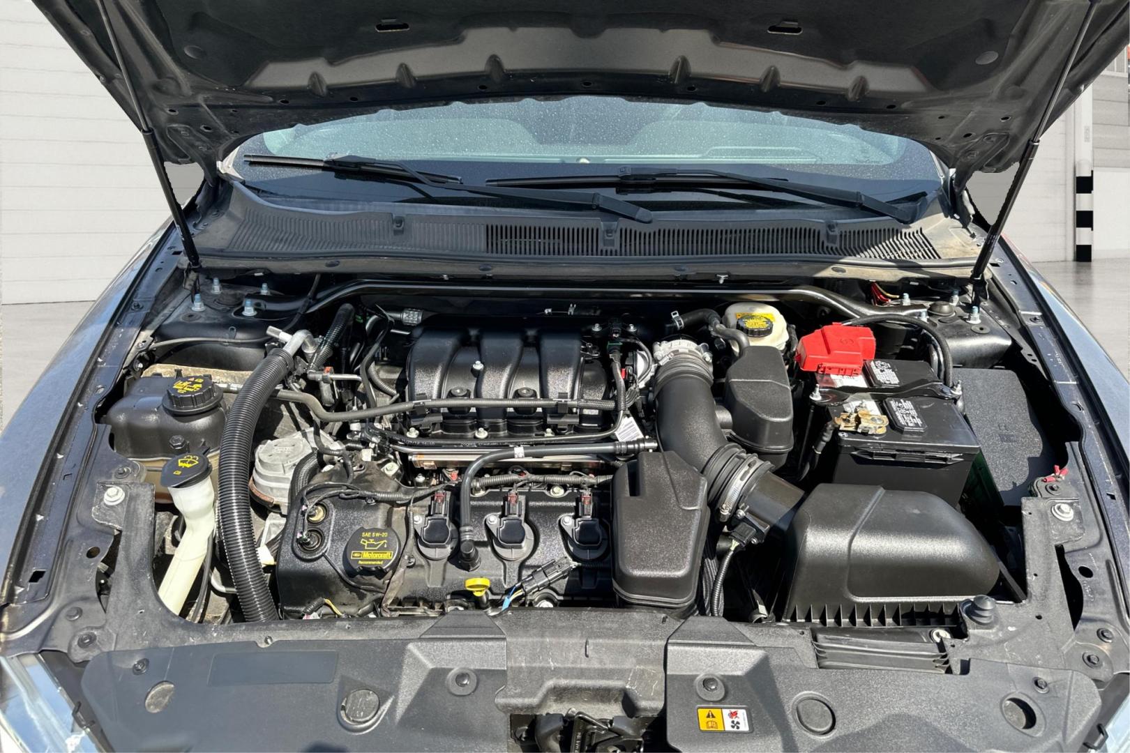 2013 Gray Ford Taurus SEL FWD (1FAHP2E87DG) with an 3.5L V6 DOHC 24V engine, 6-Speed Automatic transmission, located at 7755 State Street, Midvale, UT, 84047, (801) 753-9063, 40.610329, -111.892159 - Photo#10
