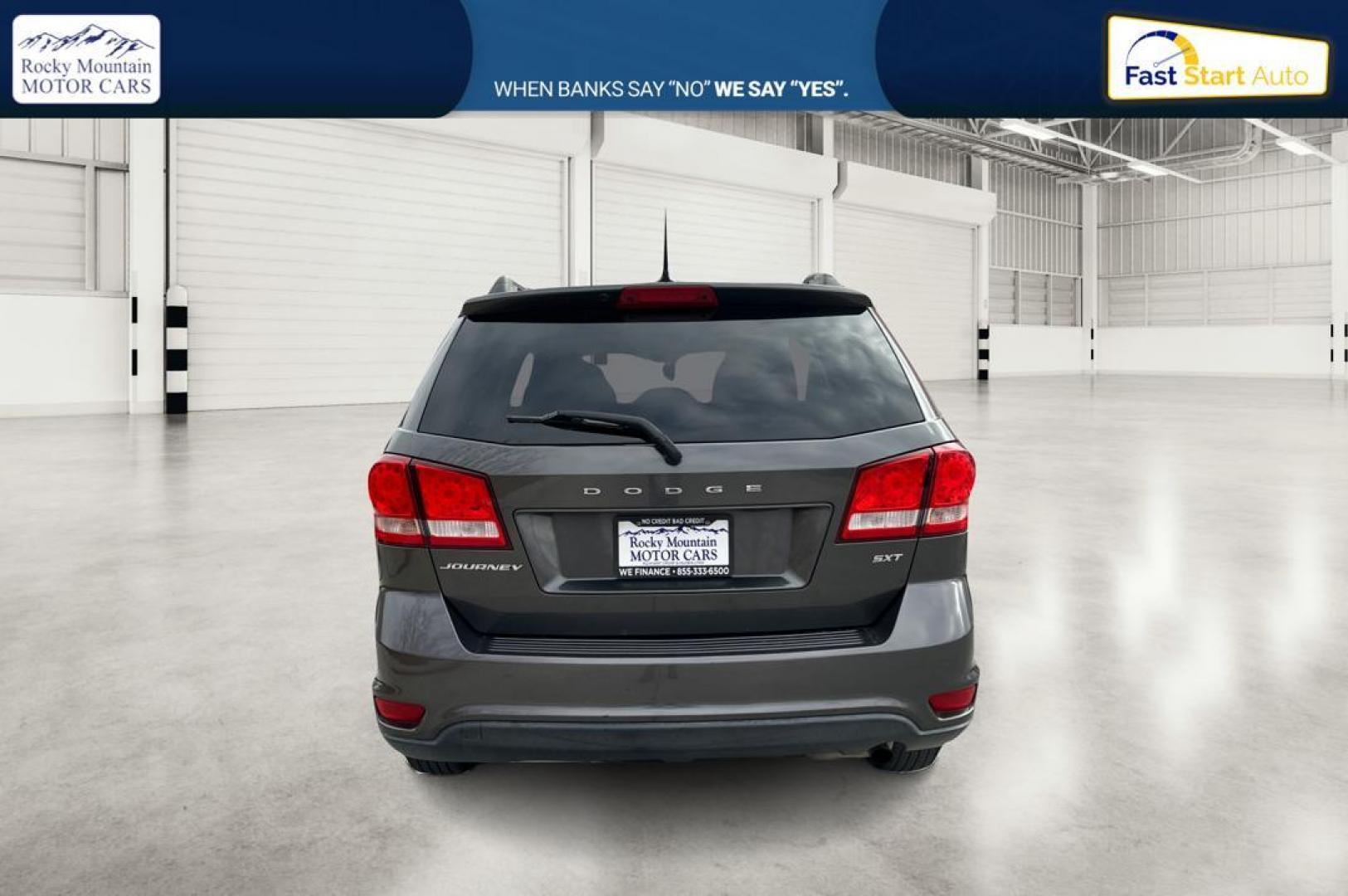2014 Gray Dodge Journey SXT (3C4PDCBB6ET) with an 2.4L L6 DOHC 16V engine, 4-Speed Automatic transmission, located at 7755 State Street, Midvale, UT, 84047, (801) 753-9063, 40.610329, -111.892159 - Photo#4