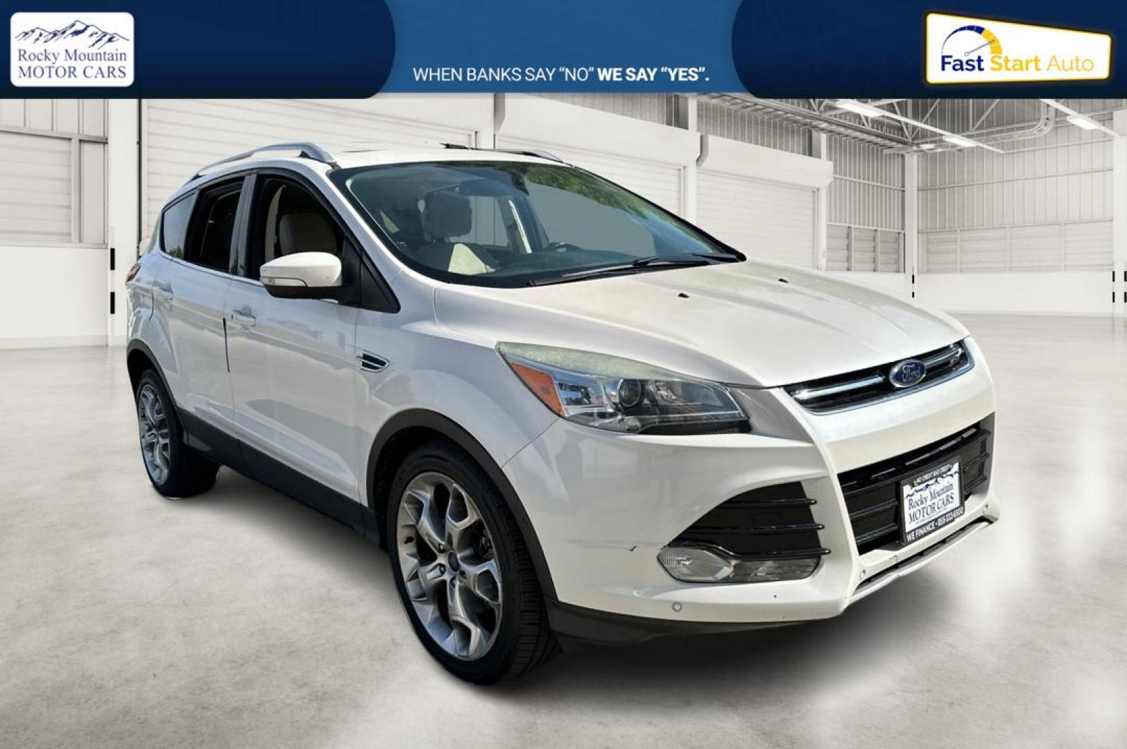 2014 White Ford Escape Titanium 4WD (1FMCU9J96EU) with an 2.0L L4 DOHC 16V engine, 6-Speed Automatic transmission, located at 767 S State Road, Pleasant Grove, UT, 84062, (801) 785-1058, 40.354839, -111.736687 - Photo#0