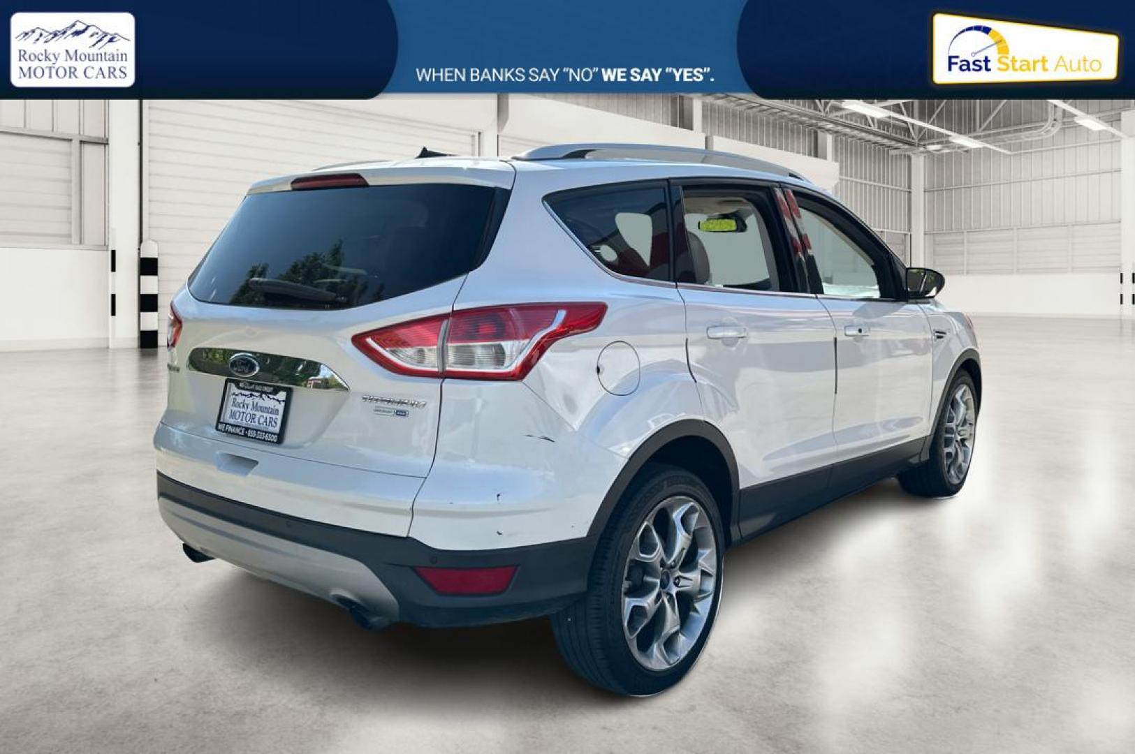 2014 White Ford Escape Titanium 4WD (1FMCU9J96EU) with an 2.0L L4 DOHC 16V engine, 6-Speed Automatic transmission, located at 767 S State Road, Pleasant Grove, UT, 84062, (801) 785-1058, 40.354839, -111.736687 - Photo#2