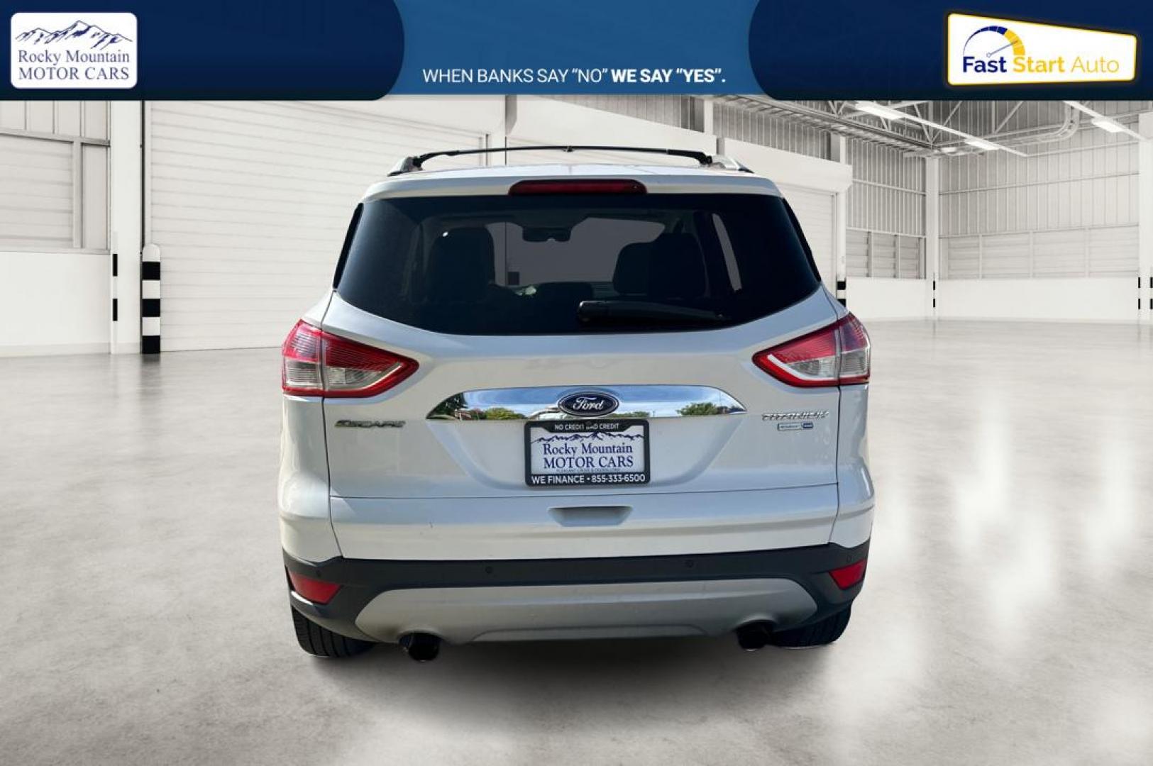 2014 White Ford Escape Titanium 4WD (1FMCU9J96EU) with an 2.0L L4 DOHC 16V engine, 6-Speed Automatic transmission, located at 767 S State Road, Pleasant Grove, UT, 84062, (801) 785-1058, 40.354839, -111.736687 - Photo#4