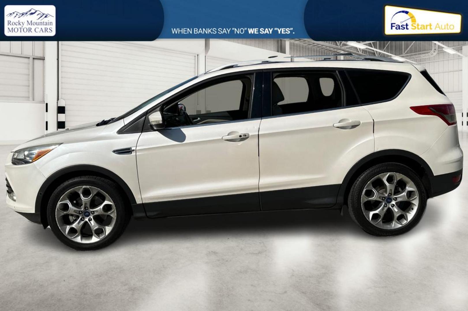 2014 White Ford Escape Titanium 4WD (1FMCU9J96EU) with an 2.0L L4 DOHC 16V engine, 6-Speed Automatic transmission, located at 767 S State Road, Pleasant Grove, UT, 84062, (801) 785-1058, 40.354839, -111.736687 - Photo#6