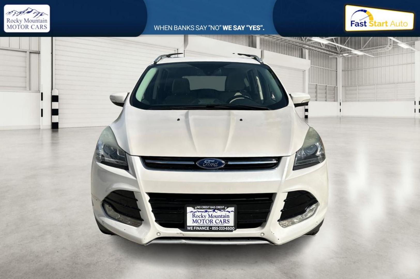 2014 White Ford Escape Titanium 4WD (1FMCU9J96EU) with an 2.0L L4 DOHC 16V engine, 6-Speed Automatic transmission, located at 767 S State Road, Pleasant Grove, UT, 84062, (801) 785-1058, 40.354839, -111.736687 - Photo#9