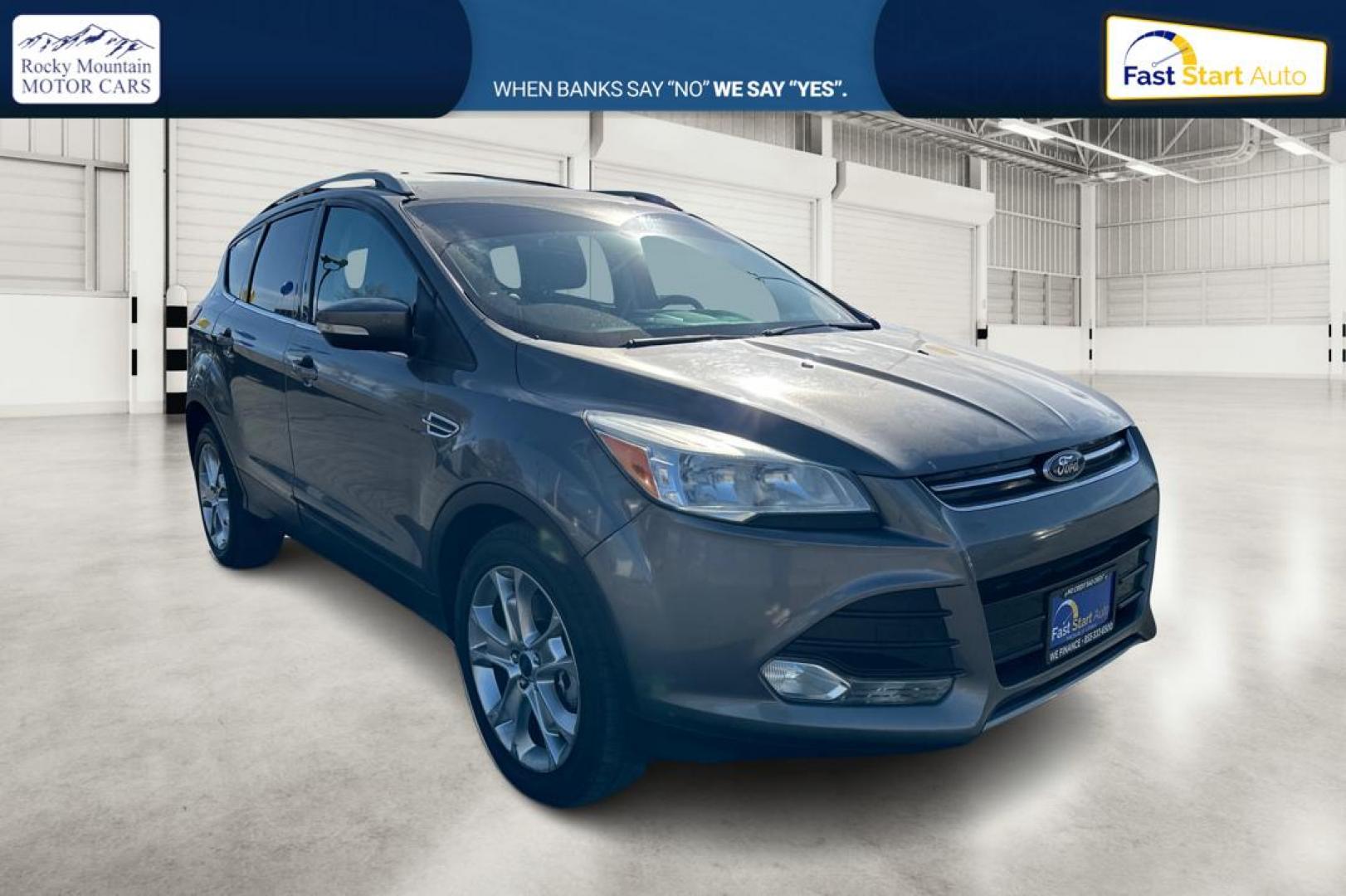 2014 Gray Ford Escape Titanium FWD (1FMCU0J97EU) with an 2.0L L4 DOHC 16V engine, 6-Speed Automatic transmission, located at 7755 State Street, Midvale, UT, 84047, (801) 753-9063, 40.610329, -111.892159 - Photo#0