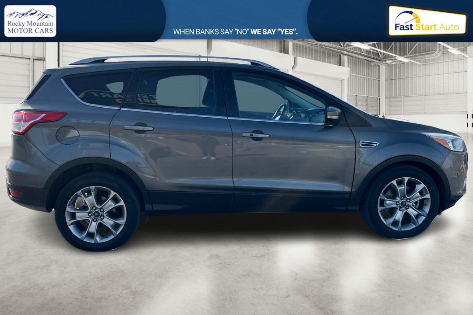 2014 Gray Ford Escape Titanium FWD (1FMCU0J97EU) with an 2.0L L4 DOHC 16V engine, 6-Speed Automatic transmission, located at 7755 State Street, Midvale, UT, 84047, (801) 753-9063, 40.610329, -111.892159 - Photo#1