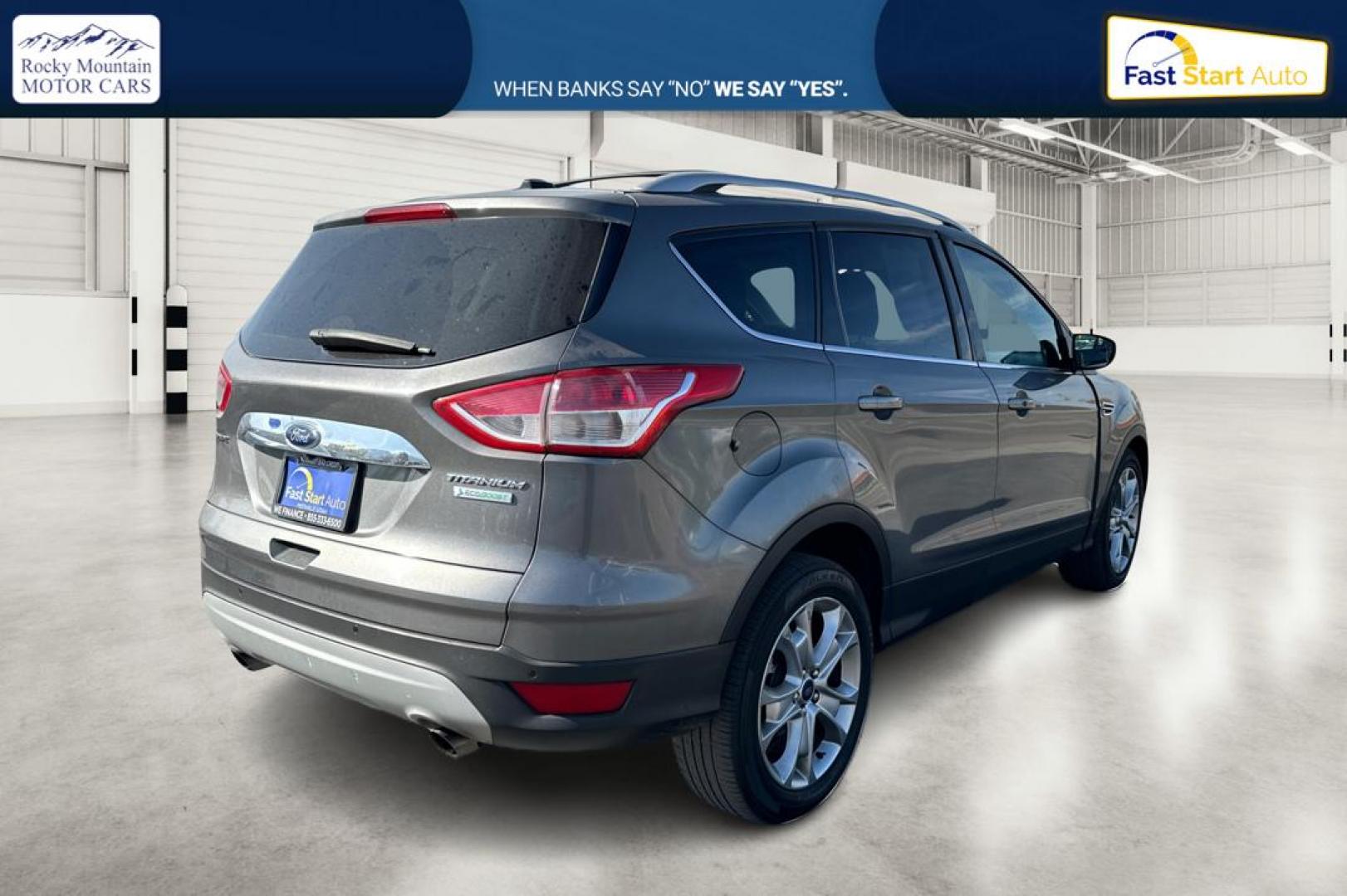2014 Gray Ford Escape Titanium FWD (1FMCU0J97EU) with an 2.0L L4 DOHC 16V engine, 6-Speed Automatic transmission, located at 7755 State Street, Midvale, UT, 84047, (801) 753-9063, 40.610329, -111.892159 - Photo#2
