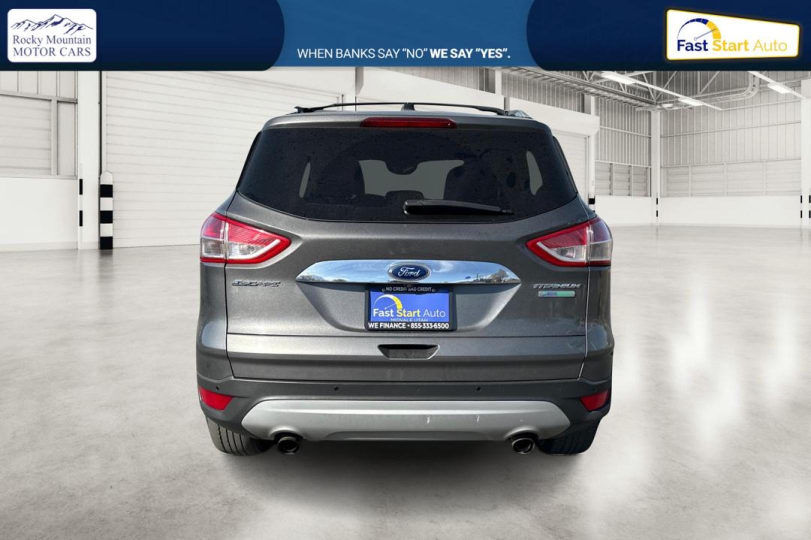 2014 Gray Ford Escape Titanium FWD (1FMCU0J97EU) with an 2.0L L4 DOHC 16V engine, 6-Speed Automatic transmission, located at 7755 State Street, Midvale, UT, 84047, (801) 753-9063, 40.610329, -111.892159 - Photo#4