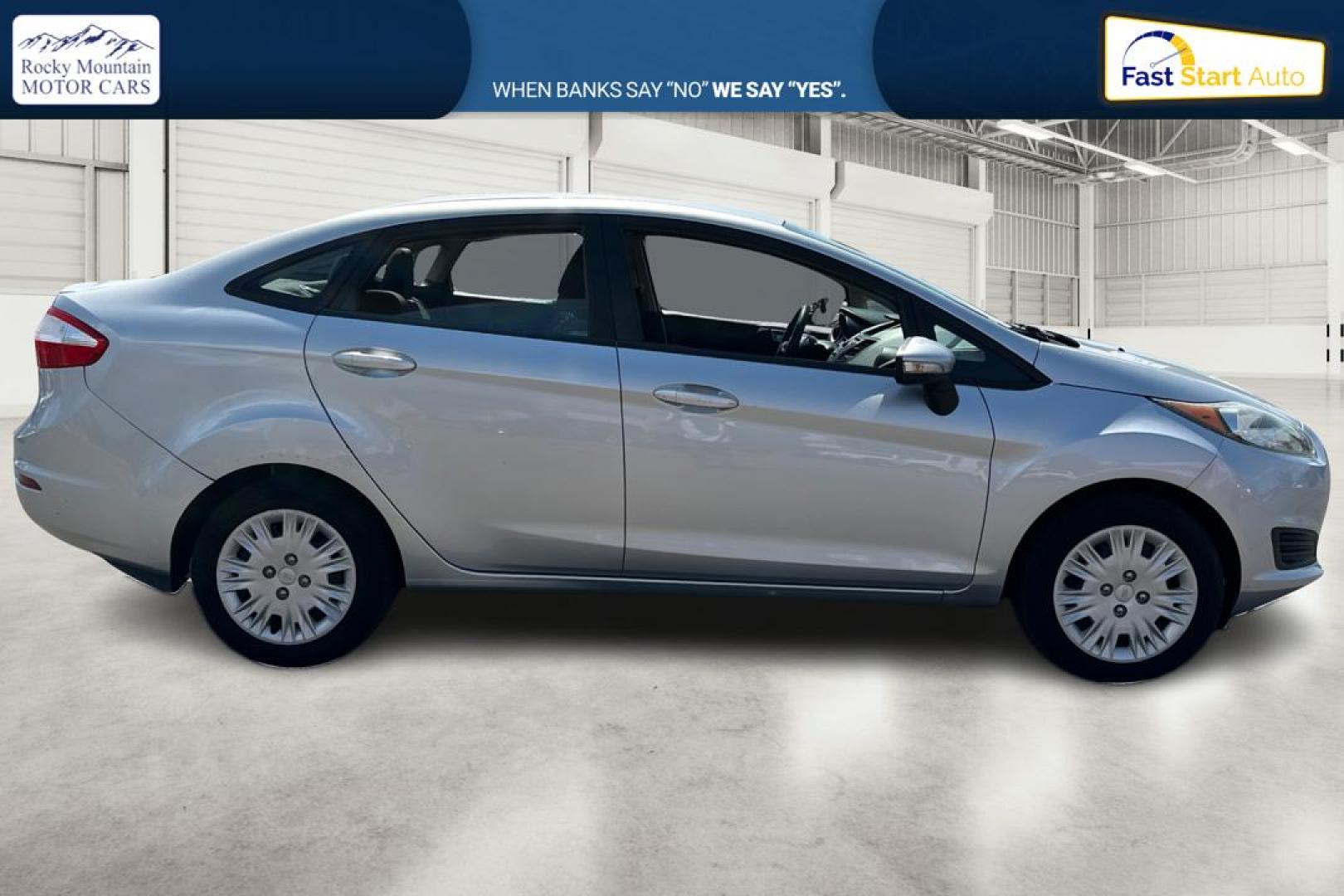 2014 Silver Ford Fiesta SE Sedan (3FADP4BJ8EM) with an 1.6L L4 DOHC 16V engine, Manual, 5-Spd transmission, located at 767 S State Road, Pleasant Grove, UT, 84062, (801) 785-1058, 40.354839, -111.736687 - Photo#1