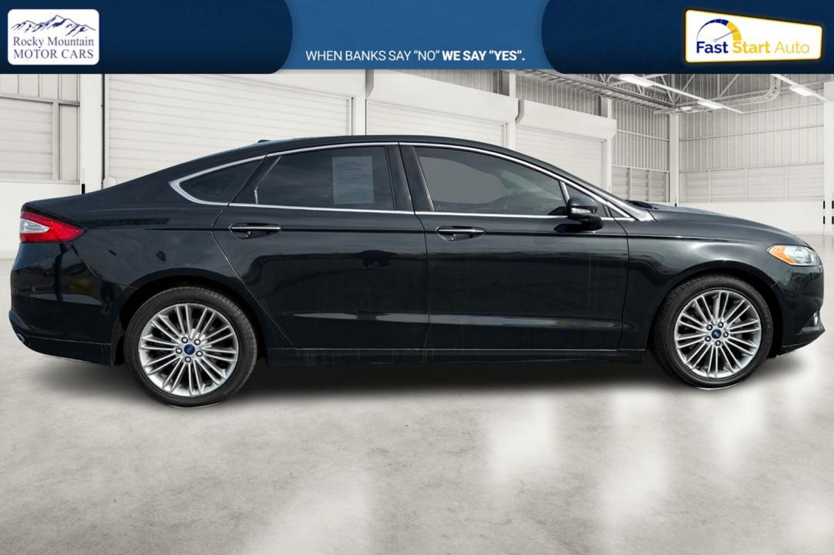 2014 Black Ford Fusion SE (3FA6P0H94ER) with an 2.0L L4 DOHC 16V engine, Automatic, 6-Spd transmission, located at 767 S State Road, Pleasant Grove, UT, 84062, (801) 785-1058, 40.354839, -111.736687 - Photo#1