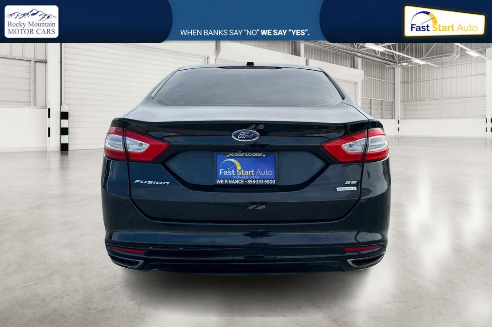 2014 Black Ford Fusion SE (3FA6P0H94ER) with an 2.0L L4 DOHC 16V engine, Automatic, 6-Spd transmission, located at 767 S State Road, Pleasant Grove, UT, 84062, (801) 785-1058, 40.354839, -111.736687 - Photo#4