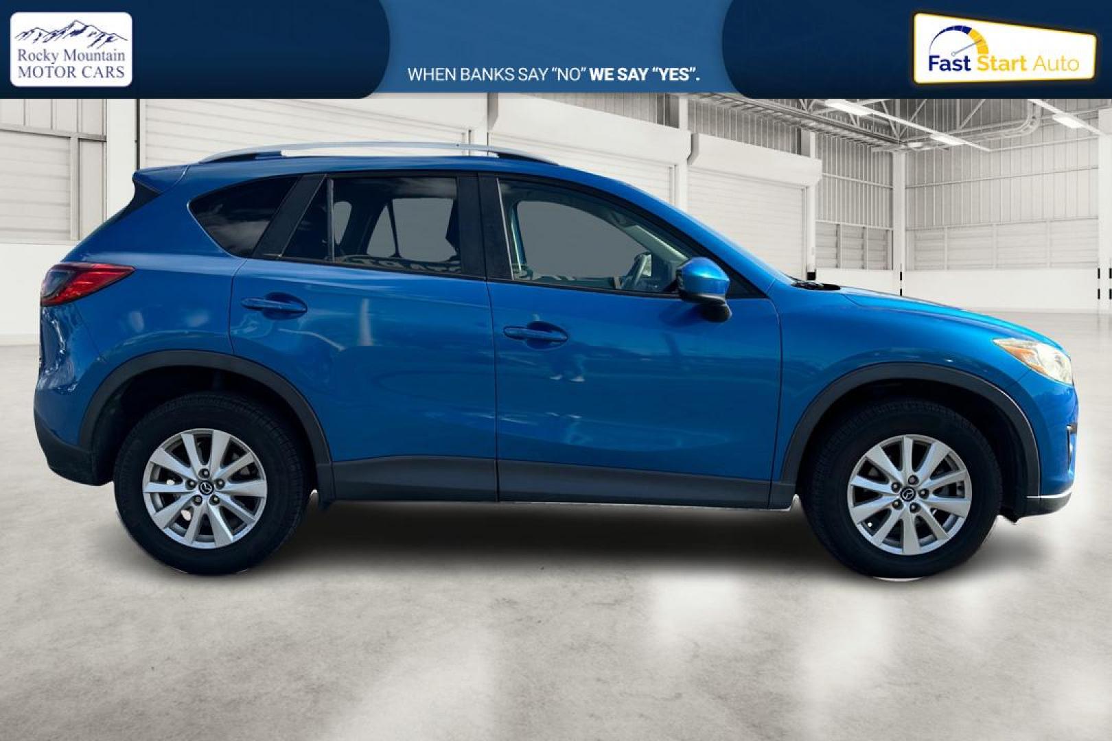 2014 Blue Mazda CX-5 Touring (JM3KE2CY1E0) with an 2.5L L4 DOHC 16V engine, 6-Speed Automatic transmission, located at 7755 State Street, Midvale, UT, 84047, (801) 753-9063, 40.610329, -111.892159 - Photo#1