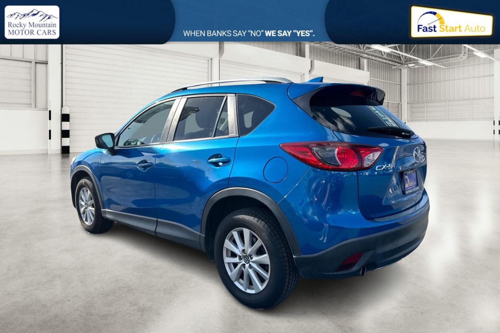 2014 Blue Mazda CX-5 Touring (JM3KE2CY1E0) with an 2.5L L4 DOHC 16V engine, 6-Speed Automatic transmission, located at 7755 State Street, Midvale, UT, 84047, (801) 753-9063, 40.610329, -111.892159 - Photo#5