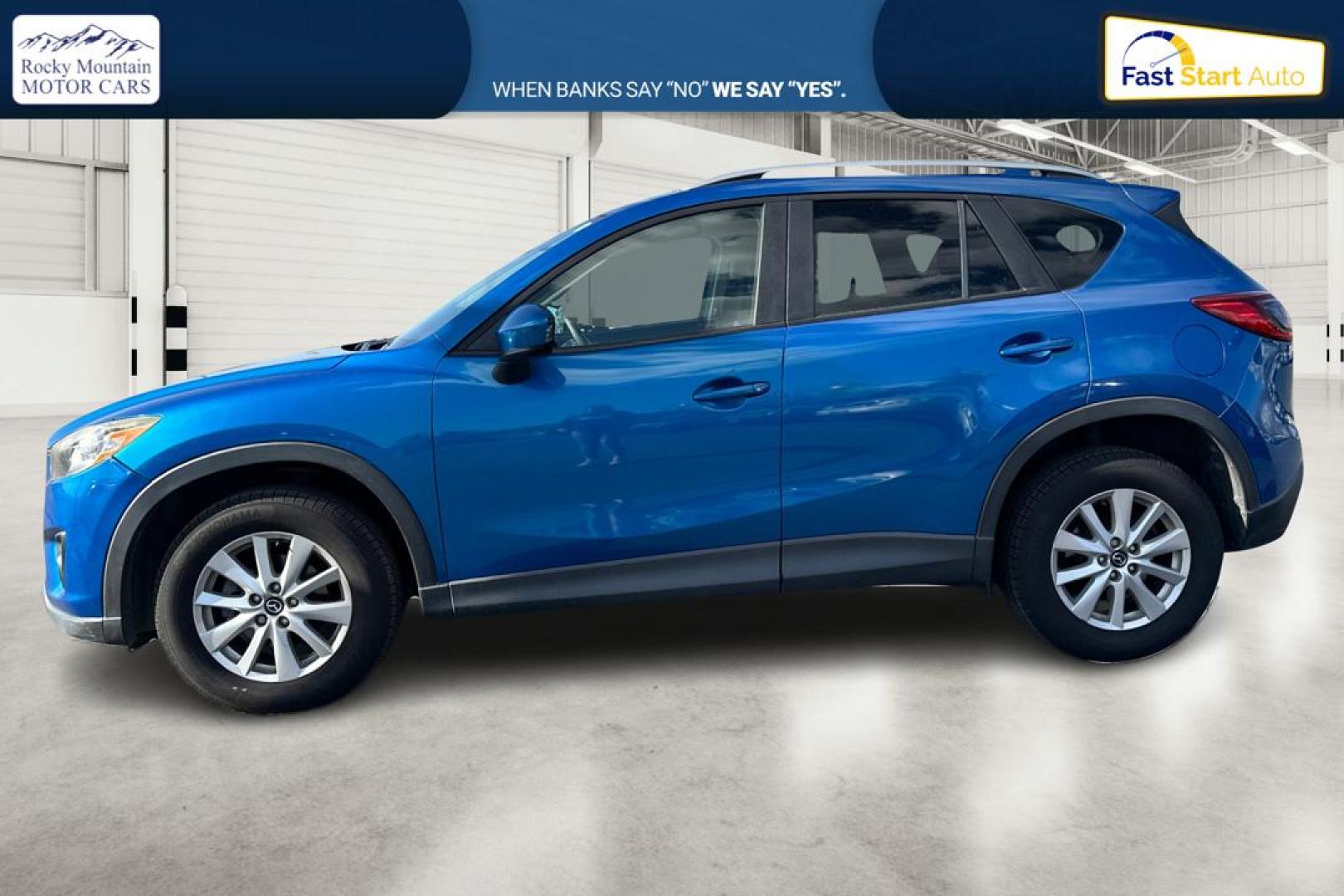 2014 Blue Mazda CX-5 Touring (JM3KE2CY1E0) with an 2.5L L4 DOHC 16V engine, 6-Speed Automatic transmission, located at 7755 State Street, Midvale, UT, 84047, (801) 753-9063, 40.610329, -111.892159 - Photo#6
