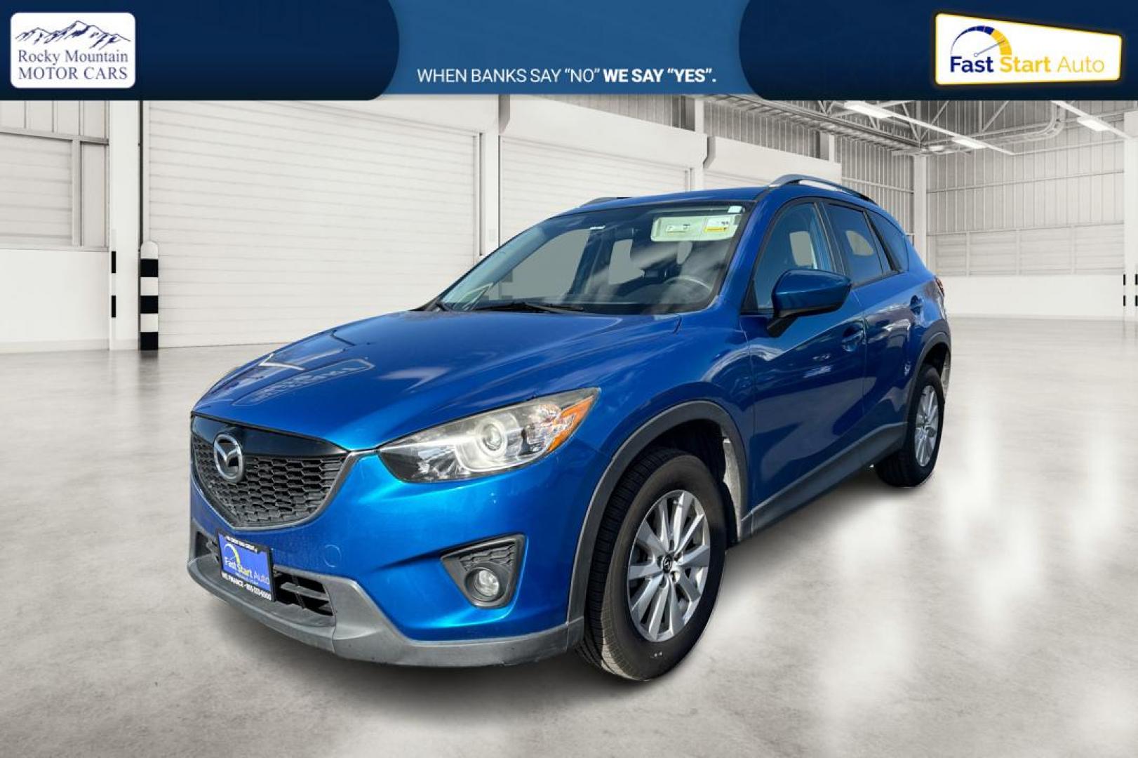 2014 Blue Mazda CX-5 Touring (JM3KE2CY1E0) with an 2.5L L4 DOHC 16V engine, 6-Speed Automatic transmission, located at 7755 State Street, Midvale, UT, 84047, (801) 753-9063, 40.610329, -111.892159 - Photo#8