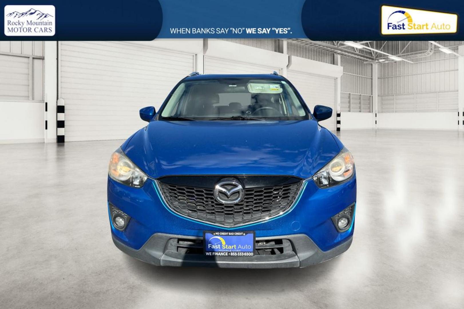 2014 Blue Mazda CX-5 Touring (JM3KE2CY1E0) with an 2.5L L4 DOHC 16V engine, 6-Speed Automatic transmission, located at 7755 State Street, Midvale, UT, 84047, (801) 753-9063, 40.610329, -111.892159 - Photo#9