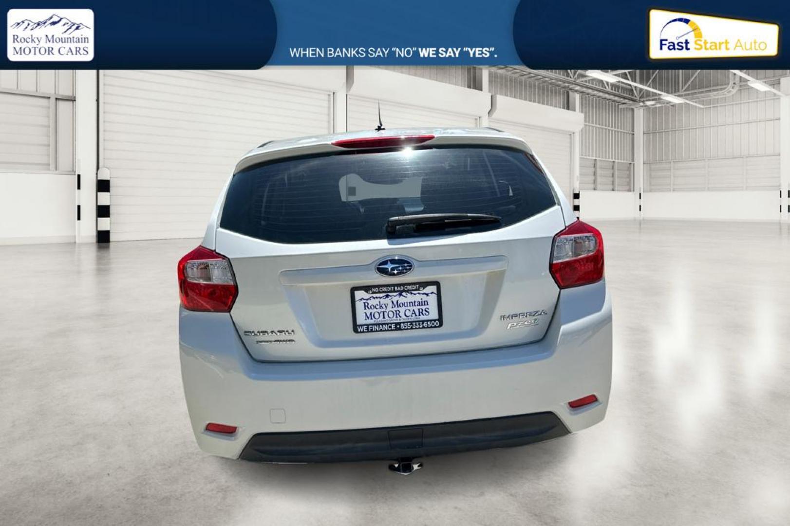 2014 White Subaru Impreza 2.0i Premium 5-Door w/All Weather Package (JF1GPAC66EH) with an 2.0L H4 DOHC 16V engine, Continuously Variable Transmission transmission, located at 767 S State Road, Pleasant Grove, UT, 84062, (801) 785-1058, 40.354839, -111.736687 - Photo#4