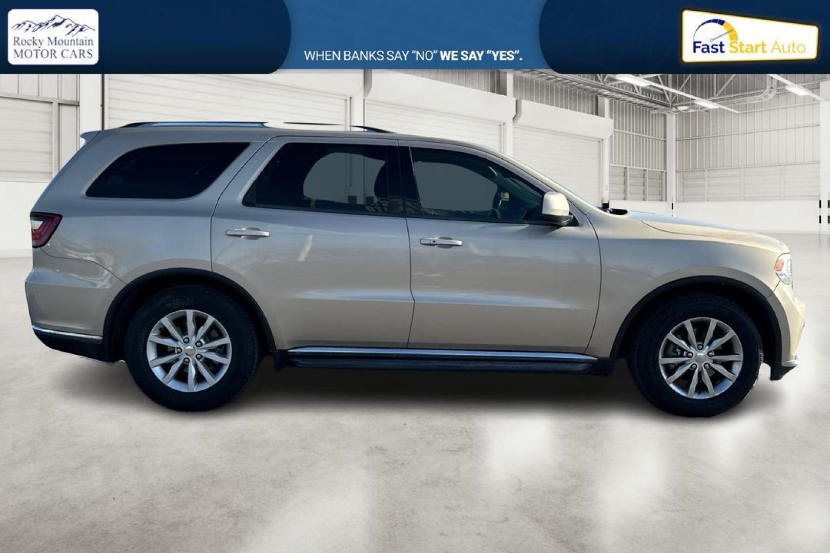 2015 Gold Dodge Durango SXT RWD (1C4RDHAG4FC) with an 3.6L V6 DOHC 24V engine, 8-Speed Automatic transmission, located at 7755 State Street, Midvale, UT, 84047, (801) 753-9063, 40.610329, -111.892159 - Photo#1