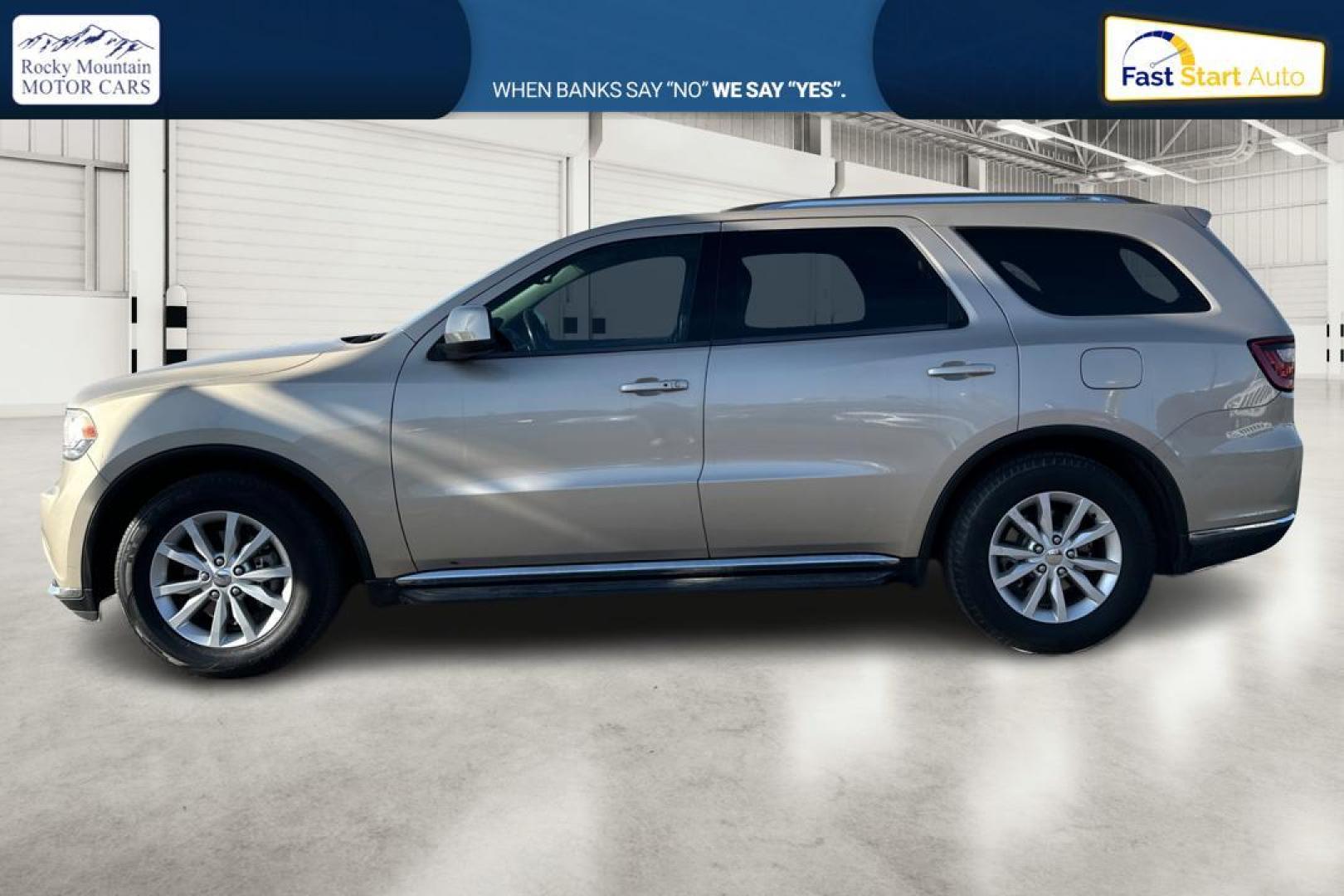 2015 Gold Dodge Durango SXT RWD (1C4RDHAG4FC) with an 3.6L V6 DOHC 24V engine, 8-Speed Automatic transmission, located at 7755 State Street, Midvale, UT, 84047, (801) 753-9063, 40.610329, -111.892159 - Photo#6