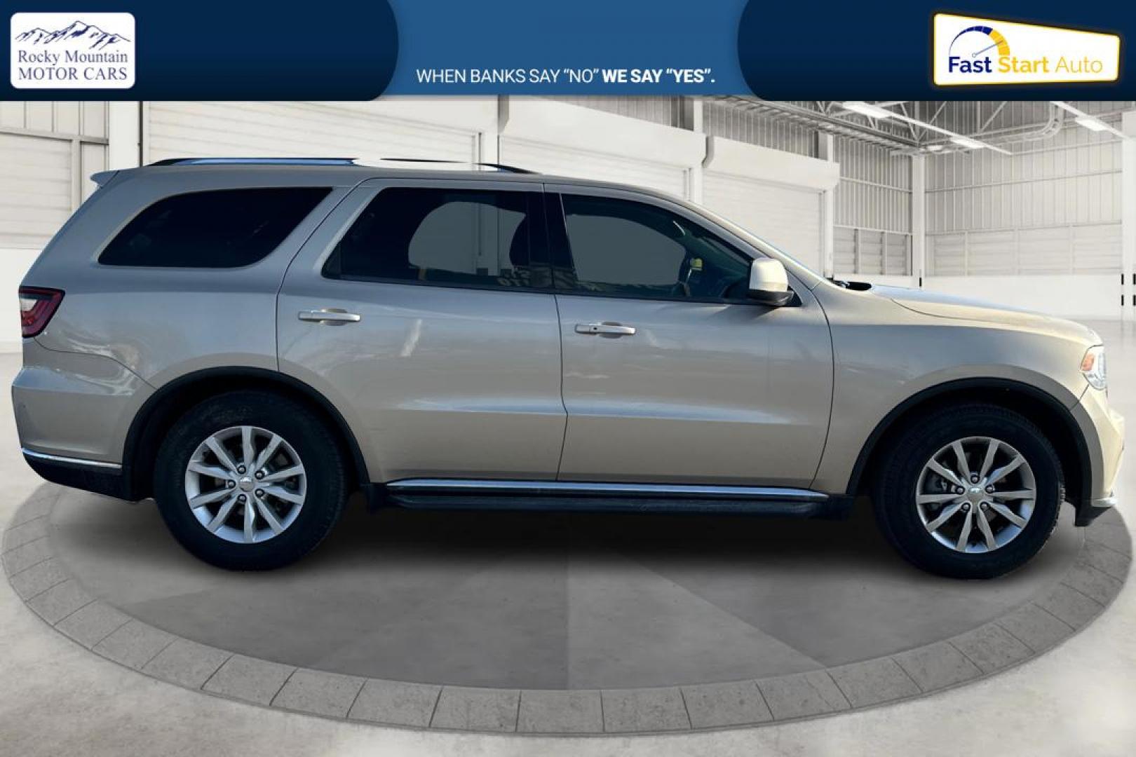 2015 Gold Dodge Durango SXT RWD (1C4RDHAG4FC) with an 3.6L V6 DOHC 24V engine, 8-Speed Automatic transmission, located at 7755 State Street, Midvale, UT, 84047, (801) 753-9063, 40.610329, -111.892159 - Photo#1