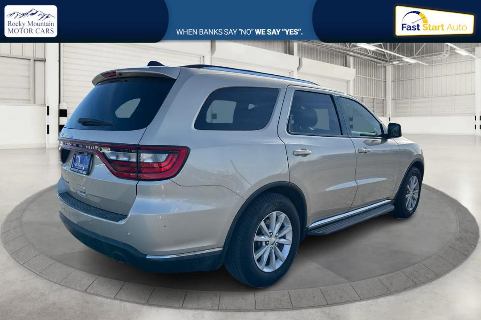 2015 Gold Dodge Durango SXT RWD (1C4RDHAG4FC) with an 3.6L V6 DOHC 24V engine, 8-Speed Automatic transmission, located at 7755 State Street, Midvale, UT, 84047, (801) 753-9063, 40.610329, -111.892159 - Photo#2
