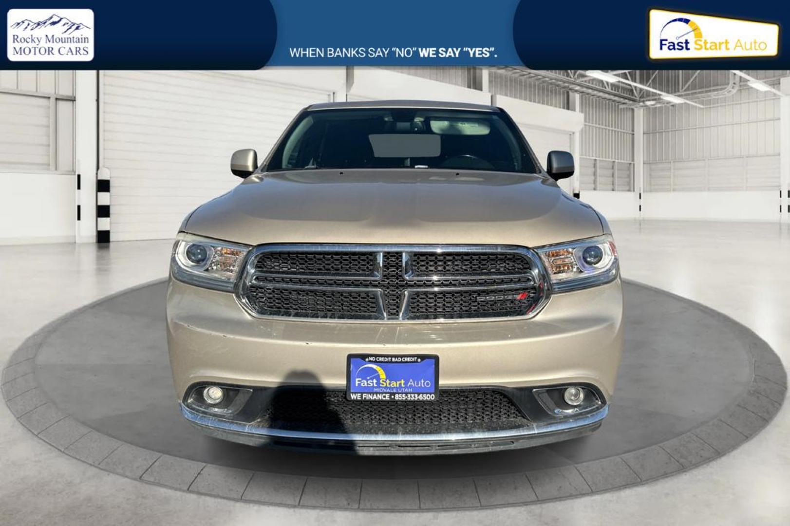 2015 Gold Dodge Durango SXT RWD (1C4RDHAG4FC) with an 3.6L V6 DOHC 24V engine, 8-Speed Automatic transmission, located at 7755 State Street, Midvale, UT, 84047, (801) 753-9063, 40.610329, -111.892159 - Photo#7