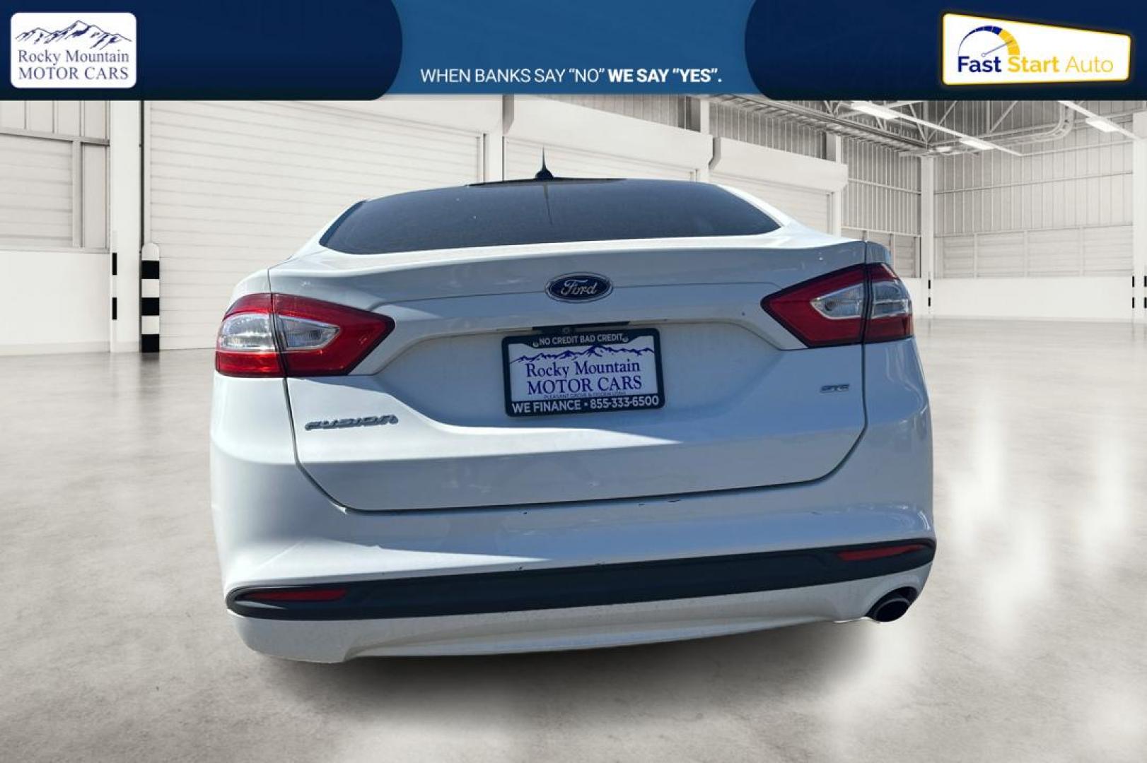 2015 White Ford Fusion SE (3FA6P0H71FR) with an 2.5L L4 DOHC 16V engine, Auto, 6-Spd w/SelShft transmission, located at 7755 State Street, Midvale, UT, 84047, (801) 753-9063, 40.610329, -111.892159 - Photo#4