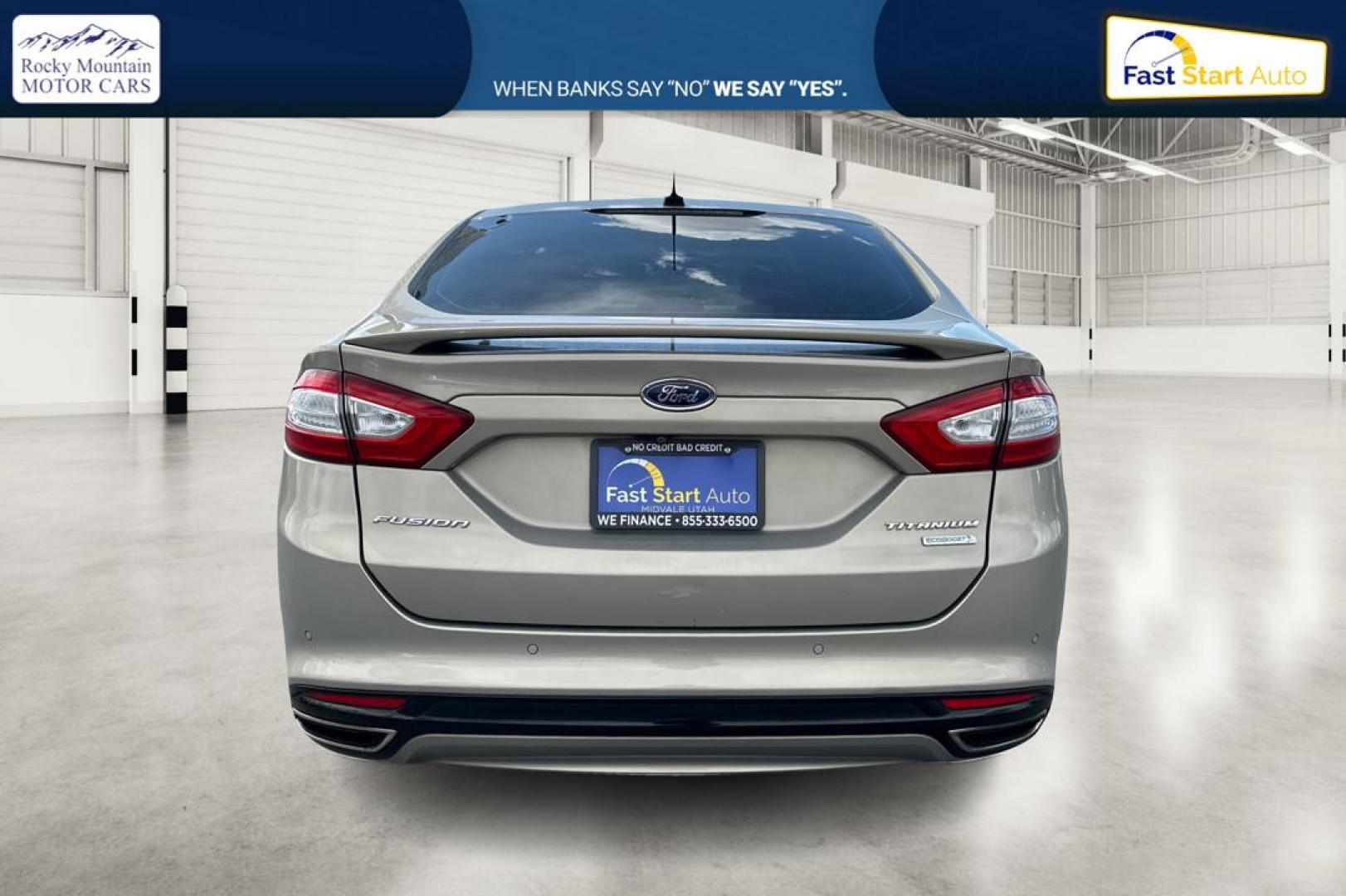 2015 Gray Ford Fusion Titanium (3FA6P0K93FR) with an 2.0L L4 DOHC 16V engine, Auto, 6-Spd w/SelShft transmission, located at 7755 State Street, Midvale, UT, 84047, (801) 753-9063, 40.610329, -111.892159 - Photo#4