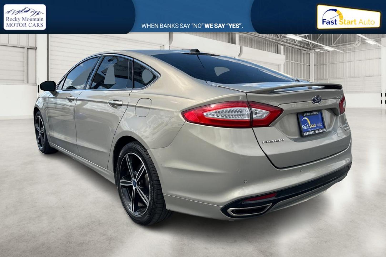 2015 Gray Ford Fusion Titanium (3FA6P0K93FR) with an 2.0L L4 DOHC 16V engine, Auto, 6-Spd w/SelShft transmission, located at 7755 State Street, Midvale, UT, 84047, (801) 753-9063, 40.610329, -111.892159 - Photo#5