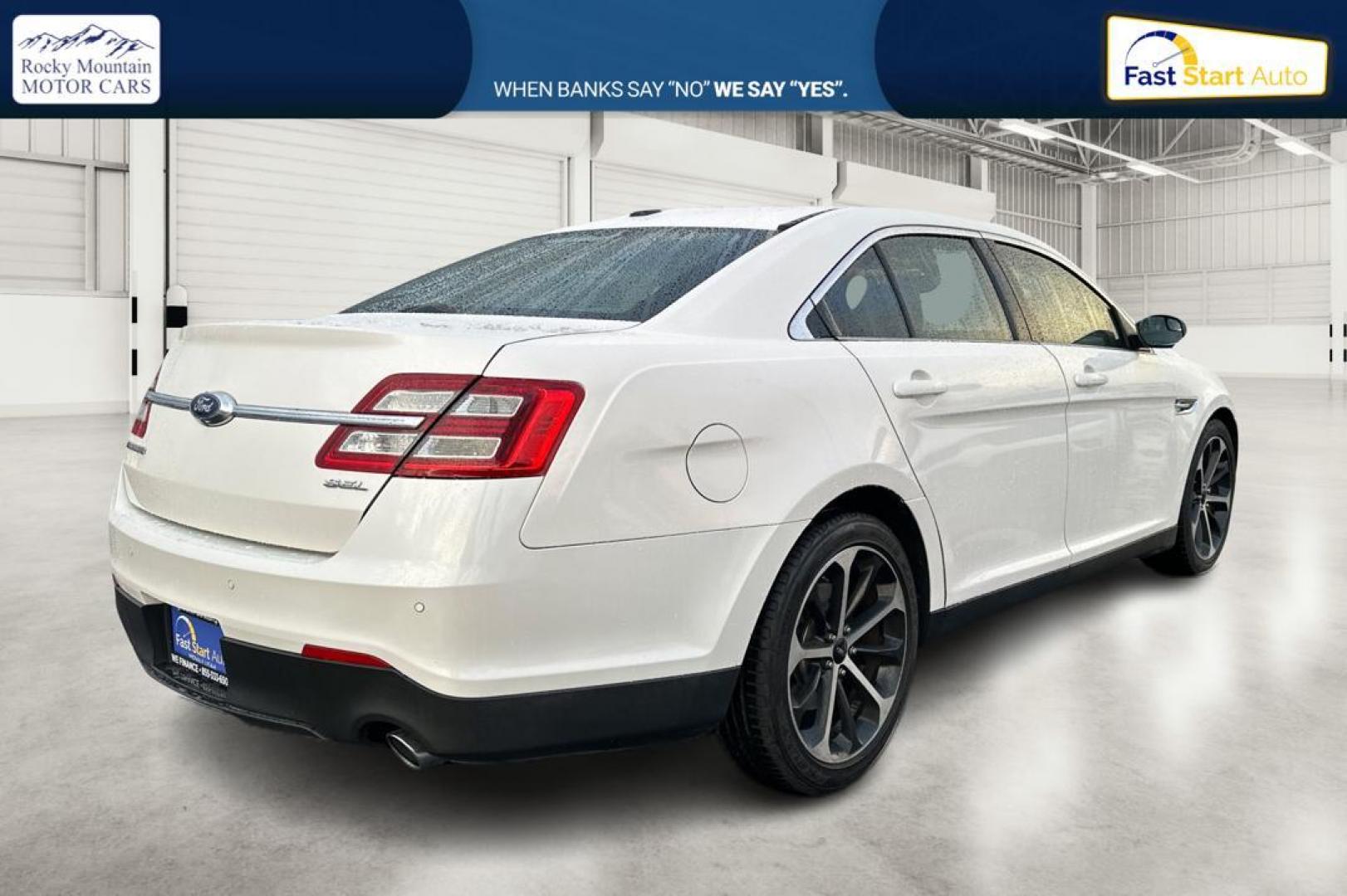 2015 White Ford Taurus SEL FWD (1FAHP2E87FG) with an 3.5L V6 DOHC 24V engine, 6-Speed Automatic transmission, located at 767 S State Road, Pleasant Grove, UT, 84062, (801) 785-1058, 40.354839, -111.736687 - Photo#2