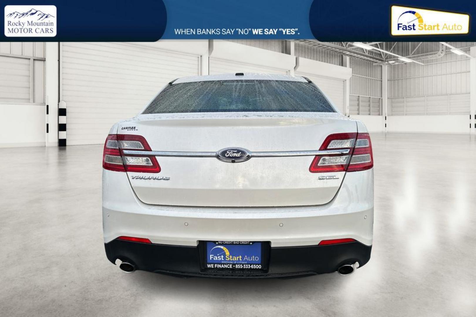 2015 White Ford Taurus SEL FWD (1FAHP2E87FG) with an 3.5L V6 DOHC 24V engine, 6-Speed Automatic transmission, located at 767 S State Road, Pleasant Grove, UT, 84062, (801) 785-1058, 40.354839, -111.736687 - Photo#4