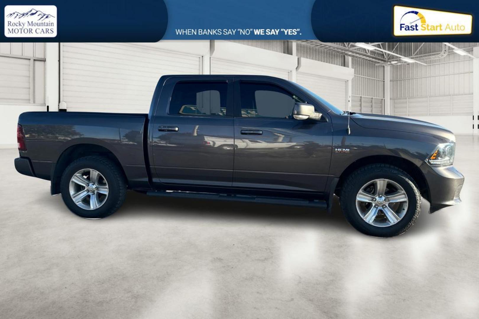 2015 Gray RAM 1500 Sport Crew Cab SWB 4WD (1C6RR7MT1FS) with an 5.7L V8 OHV 16V engine, 6-Speed Automatic transmission, located at 767 S State Road, Pleasant Grove, UT, 84062, (801) 785-1058, 40.354839, -111.736687 - Photo#1