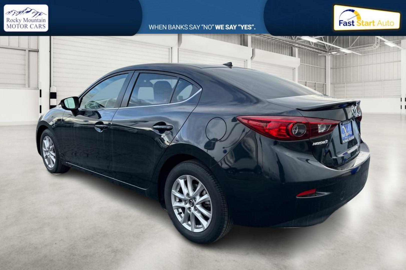 2016 Black Mazda MAZDA3 i Grand Touring MT 4-Door (JM1BM1W79G1) with an 2.0L L4 DOHC 16V engine, 6M transmission, located at 344 S Washington Blvd, Ogden, UT, 84404, (801) 399-1799, 41.255482, -111.970848 - Photo#5
