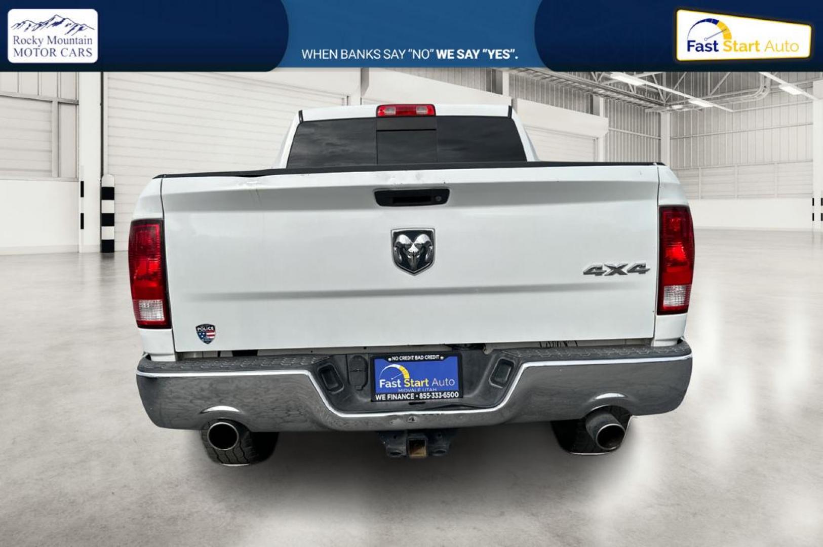 2016 White RAM 1500 SLT Quad Cab 4WD (1C6RR7GTXGS) with an 5.7L V8 OHV 16V engine, 6A transmission, located at 7755 State Street, Midvale, UT, 84047, (801) 753-9063, 40.610329, -111.892159 - Photo#4