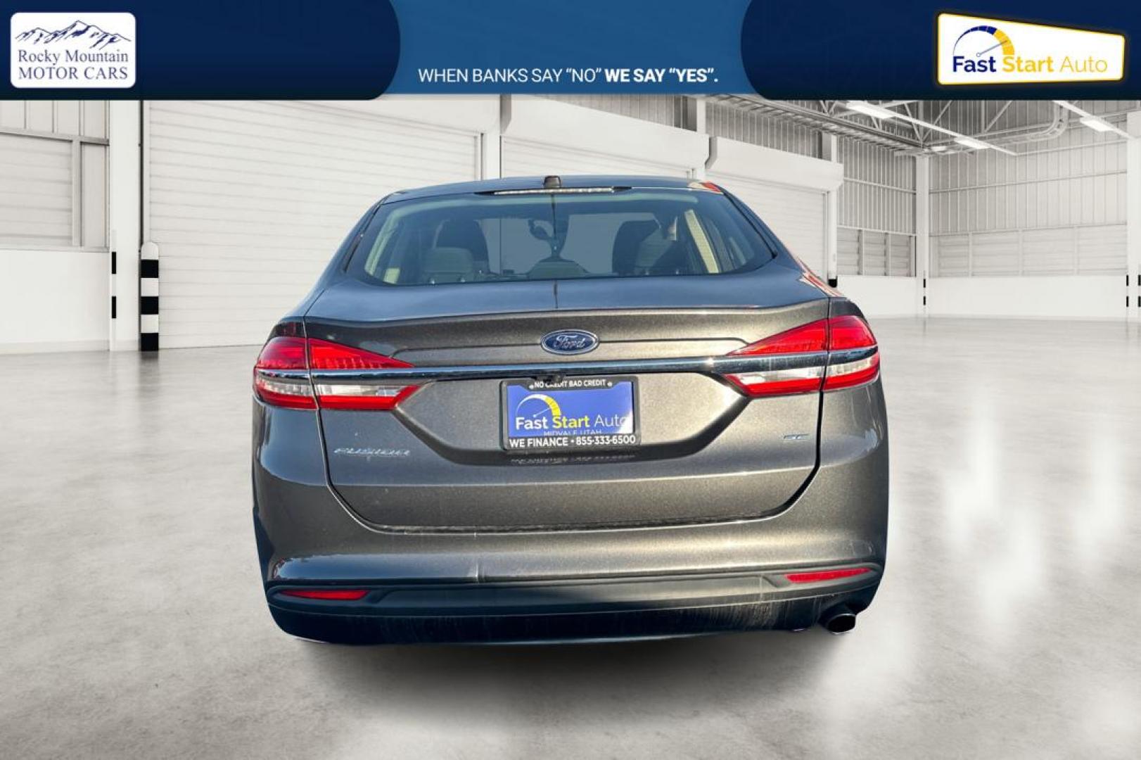 2017 Gray Ford Fusion SE (3FA6P0H74HR) with an 2.5L L4 DOHC 16V engine, 6A transmission, located at 767 S State Road, Pleasant Grove, UT, 84062, (801) 785-1058, 40.354839, -111.736687 - Photo#4