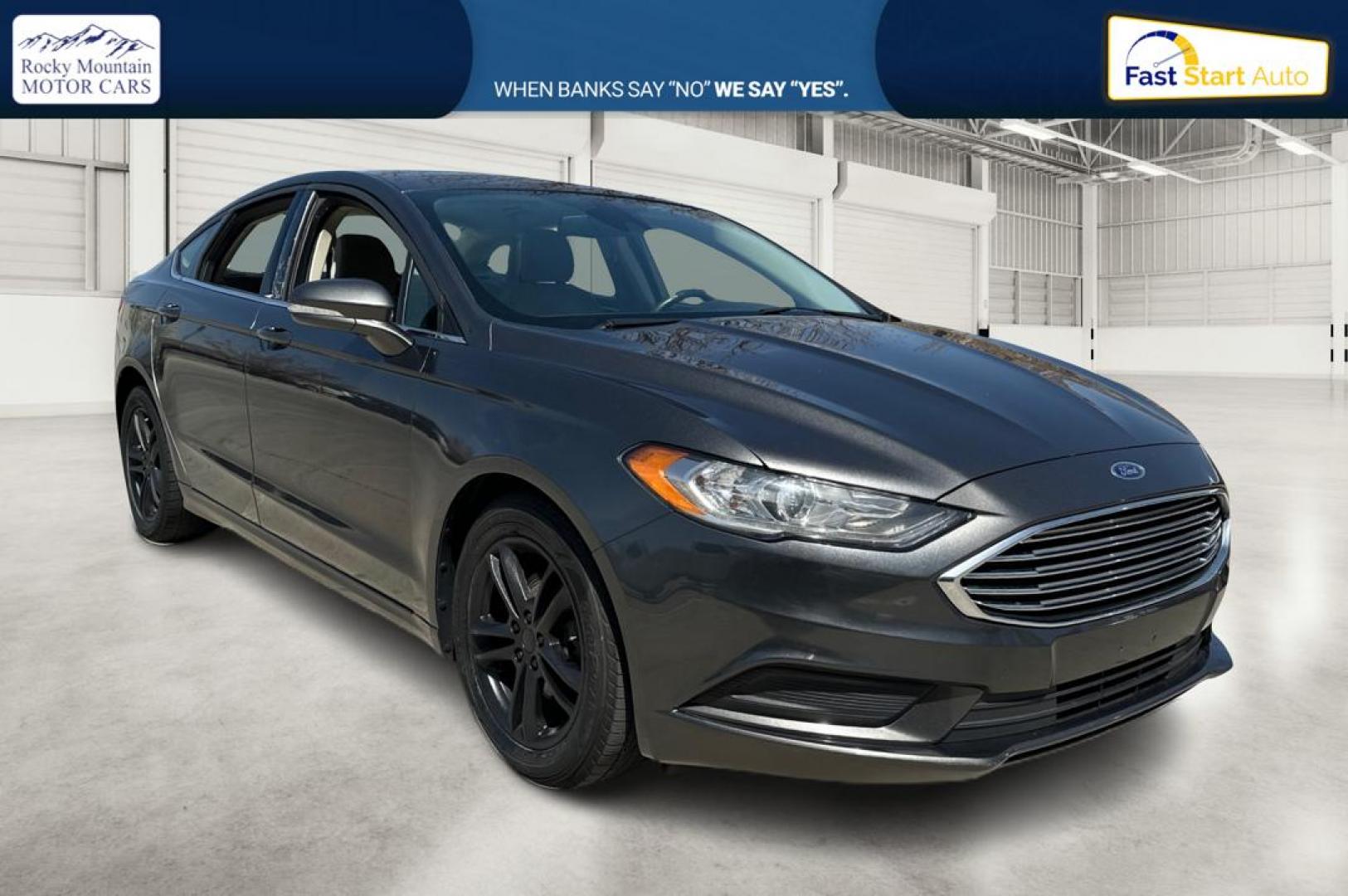2018 Gray Ford Fusion SE (3FA6P0HD7JR) with an 1.5L L4 DOHC 16V engine, 6A transmission, located at 767 S State Road, Pleasant Grove, UT, 84062, (801) 785-1058, 40.354839, -111.736687 - Photo#0