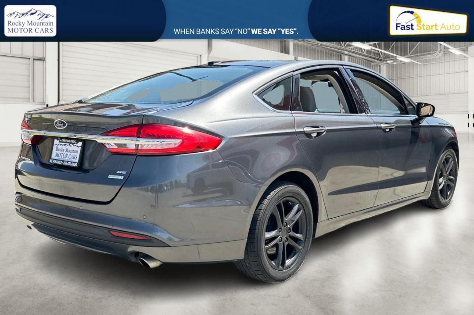 2018 Gray Ford Fusion SE (3FA6P0HD7JR) with an 1.5L L4 DOHC 16V engine, 6A transmission, located at 767 S State Road, Pleasant Grove, UT, 84062, (801) 785-1058, 40.354839, -111.736687 - Photo#2