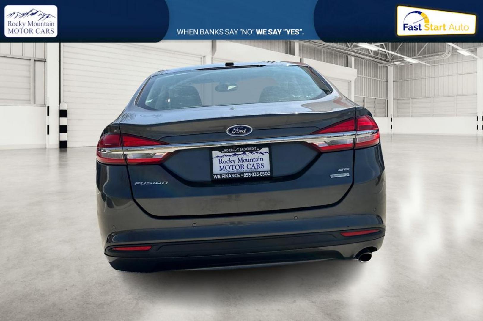 2018 Gray Ford Fusion SE (3FA6P0HD7JR) with an 1.5L L4 DOHC 16V engine, 6A transmission, located at 767 S State Road, Pleasant Grove, UT, 84062, (801) 785-1058, 40.354839, -111.736687 - Photo#4