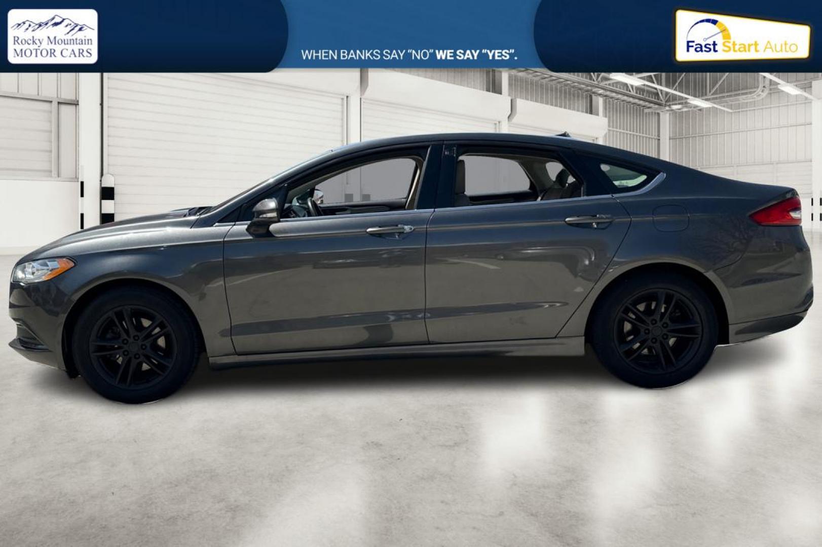 2018 Gray Ford Fusion SE (3FA6P0HD7JR) with an 1.5L L4 DOHC 16V engine, 6A transmission, located at 767 S State Road, Pleasant Grove, UT, 84062, (801) 785-1058, 40.354839, -111.736687 - Photo#6