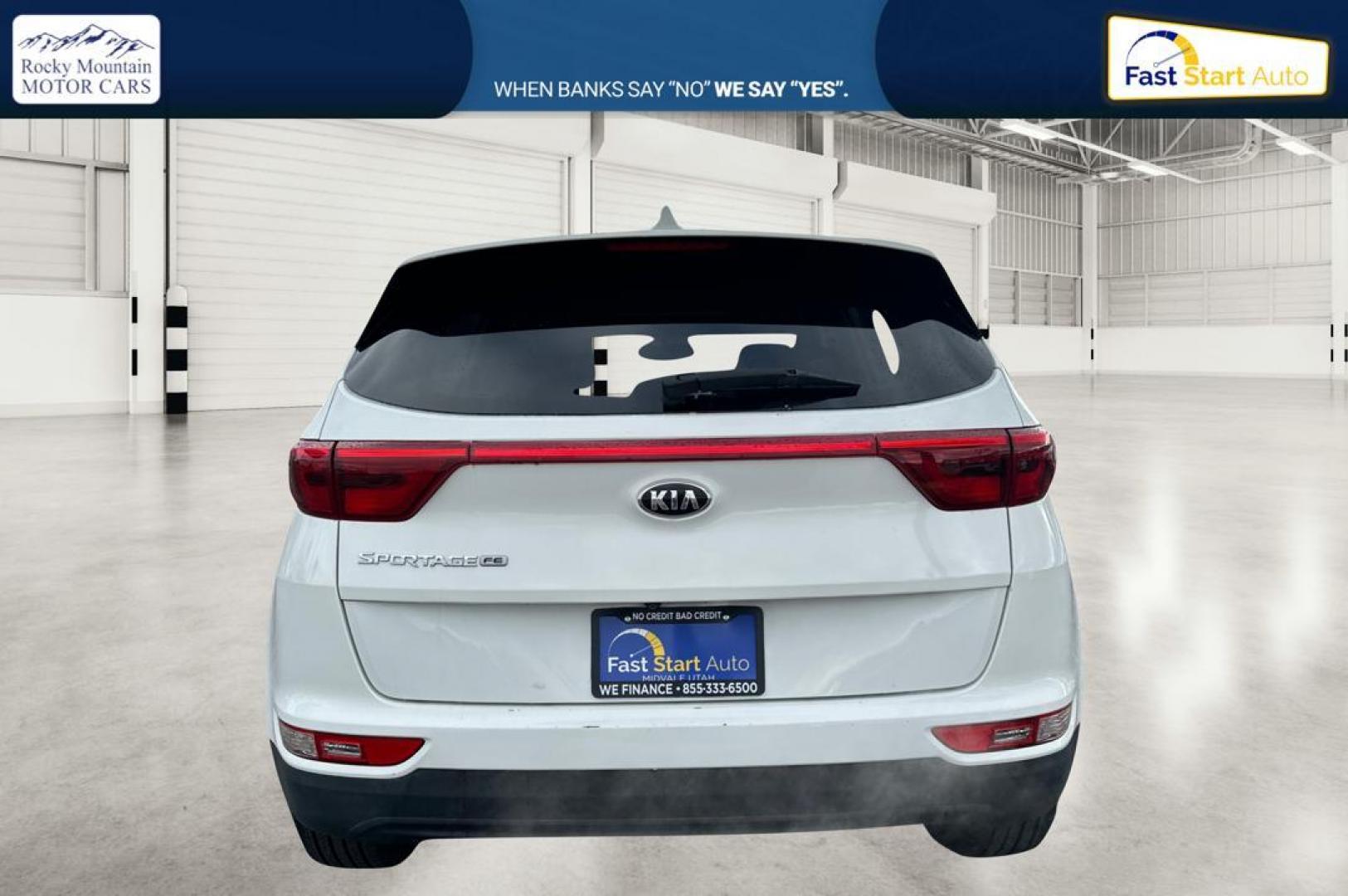2018 White Kia Sportage LX FWD (KNDPM3AC7J7) with an 2.4L V6 DOHC 24V engine, 6A transmission, located at 7755 State Street, Midvale, UT, 84047, (801) 753-9063, 40.610329, -111.892159 - Photo#4